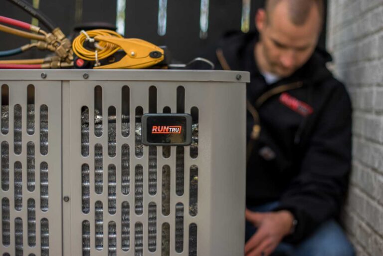 Tech working on Trane unit