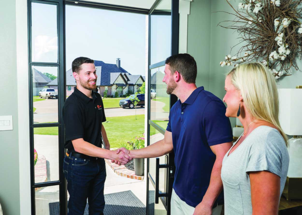 tech greeting homeowners